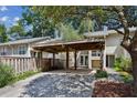 Exterior of a townhome with a shaded carport and private patio at 2106 Clairmeade Valley Ne Rd, Atlanta, GA 30329