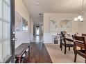 Inviting dining area with hardwood floors, seating for four, and bright natural light at 3158 Onamia Rd, Duluth, GA 30096