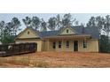 Charming, new construction, one-story home with vertical siding and dark roof in wooded setting at 554 Presley Farm Pkwy, Rockmart, GA 30153