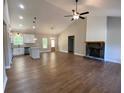 Spacious living room with modern finishes, a fireplace, and an open-concept design to the kitchen at 642 Presley Farm Pkwy, Rockmart, GA 30153