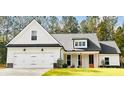 Charming one-story exterior featuring a front-facing garage and manicured lawn at 642 Presley Farm Pkwy, Rockmart, GA 30153