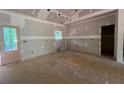 Spacious kitchen area with a door to the exterior and a window for natural light at 642 Presley Farm Pkwy, Rockmart, GA 30153
