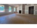 Bright living room showcasing large windows, fireplace, and open floor plan at 642 Presley Farm Pkwy, Rockmart, GA 30153