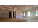 Bright living room featuring a vaulted ceiling, and views to the outdoors at 642 Presley Farm Pkwy, Rockmart, GA 30153
