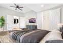 Spacious main bedroom features hardwood floors, walk-in closet, en-suite bathroom, and contemporary furnishings at 7880 Rivertown Rd, Atlanta, GA 30213
