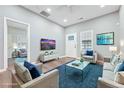 Bright living room with hardwood floors, soothing paint color, and contemporary furnishings, bathed in natural light at 7880 Rivertown Rd, Atlanta, GA 30213