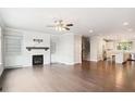 Open-concept living room with hardwood floors, fireplace, and access to a gourmet kitchen at 549 Henry Dr, Marietta, GA 30064