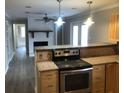 Modern kitchen with granite countertops, stainless steel appliances, and an open layout at 3387 Forest Hill Rd, Powder Springs, GA 30127