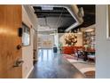 Open floor plan, featuring modern design and an industrial ceiling, provides seamless flow to outdoor living at 395 Central Park Ne Pl # 420, Atlanta, GA 30312