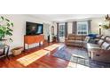 Bright living room featuring hardwood floors, lots of sunlight, and neutral paint at 5352 Waterford Dr, Dunwoody, GA 30338