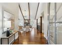 Bright and airy living room featuring vaulted ceilings, hardwood floors, fireplace and modern decor at 645 Trailmore Pl, Roswell, GA 30076