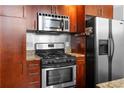 Close-up of the modern kitchen with stainless steel appliances and granite countertops at 964 Dekalb Ne Ave # 112, Atlanta, GA 30307