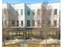 Contemporary building featuring multiple units with balconies, large windows, and sidewalk access at 2030 Main Nw St # 205, Atlanta, GA 30318