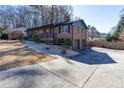 Split level brick home showcasing a large driveway and well manicured yard at 510 Debra Dr, Marietta, GA 30066