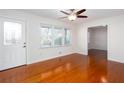 Bright living room with hardwood floors, ceiling fan, and a view of the front yard at 510 Debra Dr, Marietta, GA 30066