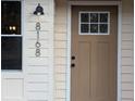 Close up of the house number and paneled front door at 8168 Spring Ct, Riverdale, GA 30274