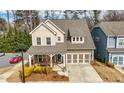 Beautiful home with covered porch, attached two-car garage, and attractive landscaping in a desirable neighborhood at 2434 Soft Maple St, Atlanta, GA 30360
