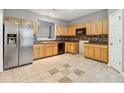 Spacious kitchen with stainless steel appliances, tile backsplash, and tile flooring at 5392 Fox Creek Ln, Norcross, GA 30071