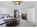 Bedroom with ceiling fan, closet and a large bed at 6517 Brenda Ann Dr, Lithonia, GA 30058