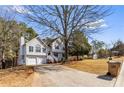 Lovely two-story home with an attached two-car garage and a long driveway at 13 Greystone Nw Ln, Cartersville, GA 30121