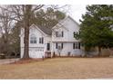Well-maintained two-story home with a manicured front lawn and mature trees at 13 Greystone Nw Ln, Cartersville, GA 30121