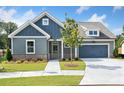 Inviting exterior showcasing a well-manicured lawn, attractive siding, and a welcoming entrance to the beautiful home at 306 Bunker Hill Ct, Acworth, GA 30102