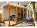 Inviting front porch with wood flooring, comfortable seating, and stylish lighting at 731 Hobart Se Ave, Atlanta, GA 30312