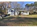 Charming single-story home featuring a well-maintained lawn, classic brick facade, and inviting front entrance at 3532 Dial Dr, Stone Mountain, GA 30083