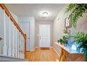 Bright foyer featuring wood floors, stairs, and a decorative console table at 1769 Old Dogwood, Jonesboro, GA 30238