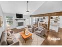 Bright, staged living room with a stone fireplace and open access to the modern kitchen at 2473 Chauncey Sw Ln, Clarkdale, GA 30064