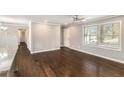 Bright and airy living room boasting gleaming hardwood floors and a ceiling fan at 2695 Terratim Ln, Decatur, GA 30034