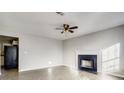 Bright living room with a decorative fireplace and wood-look flooring at 2921 Russ Ln, Lithonia, GA 30058