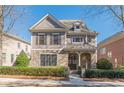Beautiful two-story home with stone accents and manicured landscaping at 3529 S Sherwood Se Rd, Smyrna, GA 30082