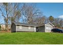 Charming single Gathering home with an inviting front yard and a private driveway at 145 Pinehurst Dr, Stockbridge, GA 30281