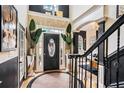 Elegant foyer with dark trim, wood floors, and modern lighting at 3647 Little Spg, Stockbridge, GA 30281