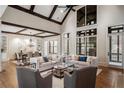 Bright living room featuring vaulted ceilings, exposed wood beams, and large windows at 4755 Columns Se Dr, Marietta, GA 30067