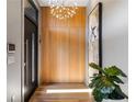 Modern foyer featuring hardwood floors, statement art, and a unique light fixture at 640 East Ne Ave, Atlanta, GA 30312