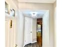 Bright entryway features a modern chandelier and wood-look floors at 2147 Palmyra Se Dr, Marietta, GA 30067