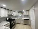 Updated kitchen with white cabinets, stainless steel appliances, and tiled backsplash at 2147 Palmyra Se Dr, Marietta, GA 30067