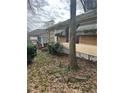 Overgrown yard and weathered exterior view of home at 1771 Hosea L Williams Se Dr, Atlanta, GA 30317