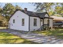 Quaint house with dark trim and a welcoming front porch, situated on a grassy lot at 2776 Grand Sw Ave, Atlanta, GA 30315