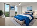 Well-lit bedroom featuring a large window, modern decor, and a comfortable bed with stylish bedding at 2870 Pharr Court South Nw # 2901, Atlanta, GA 30305