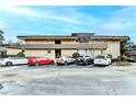 A multi-level apartment complex with brick facade, well-manicured bushes and convenient parking at 346 Carpenter Dr # 29, Atlanta, GA 30328