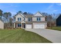 Charming new construction home with a manicured lawn and a three-car garage at 124 Felicity Pike, Locust Grove, GA 30248