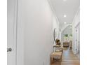 Neutral hallway leading to living area, showcasing light-colored walls and modern decor elements at 302 Bunker Hill Ct, Acworth, GA 30102