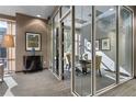 Well-lit conference room with glass doors, a table, and a view from the window, creating a bright and open space at 2626 Peachtree Nw Rd # 704, Atlanta, GA 30305
