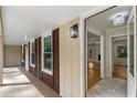 View of the cozy covered porch leading into a home featuring hardwood floors and neutral decor at 2542 Maclaren Cir, Dunwoody, GA 30360