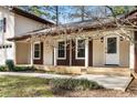 Inviting front porch with charming brown shutters accents the home's classic appeal and curb appeal at 2542 Maclaren Cir, Dunwoody, GA 30360