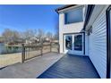 Exterior view of wooden deck with dark wood railings and sliding door access to the home at 2762 Inverloch Cir, Duluth, GA 30096