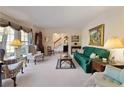Spacious living room showcasing classic decor, large windows, and seamless flow to other rooms at 5443 Dunwoody Knoll Ct, Dunwoody, GA 30338